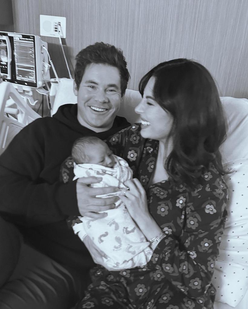 Adam Devine and Chloe Bridges with their newborn Beau