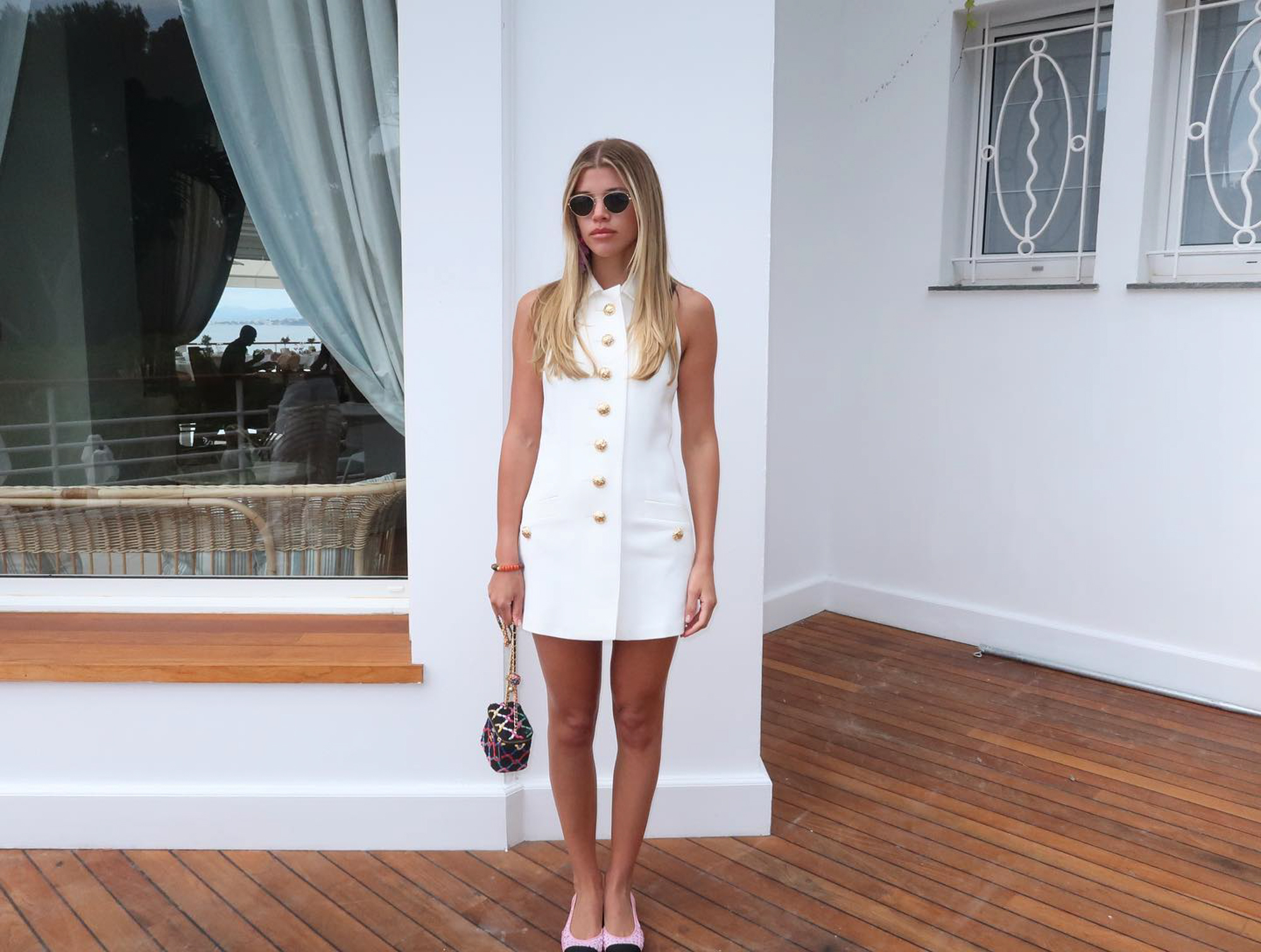 Sofia Richie in a white buttoned dress