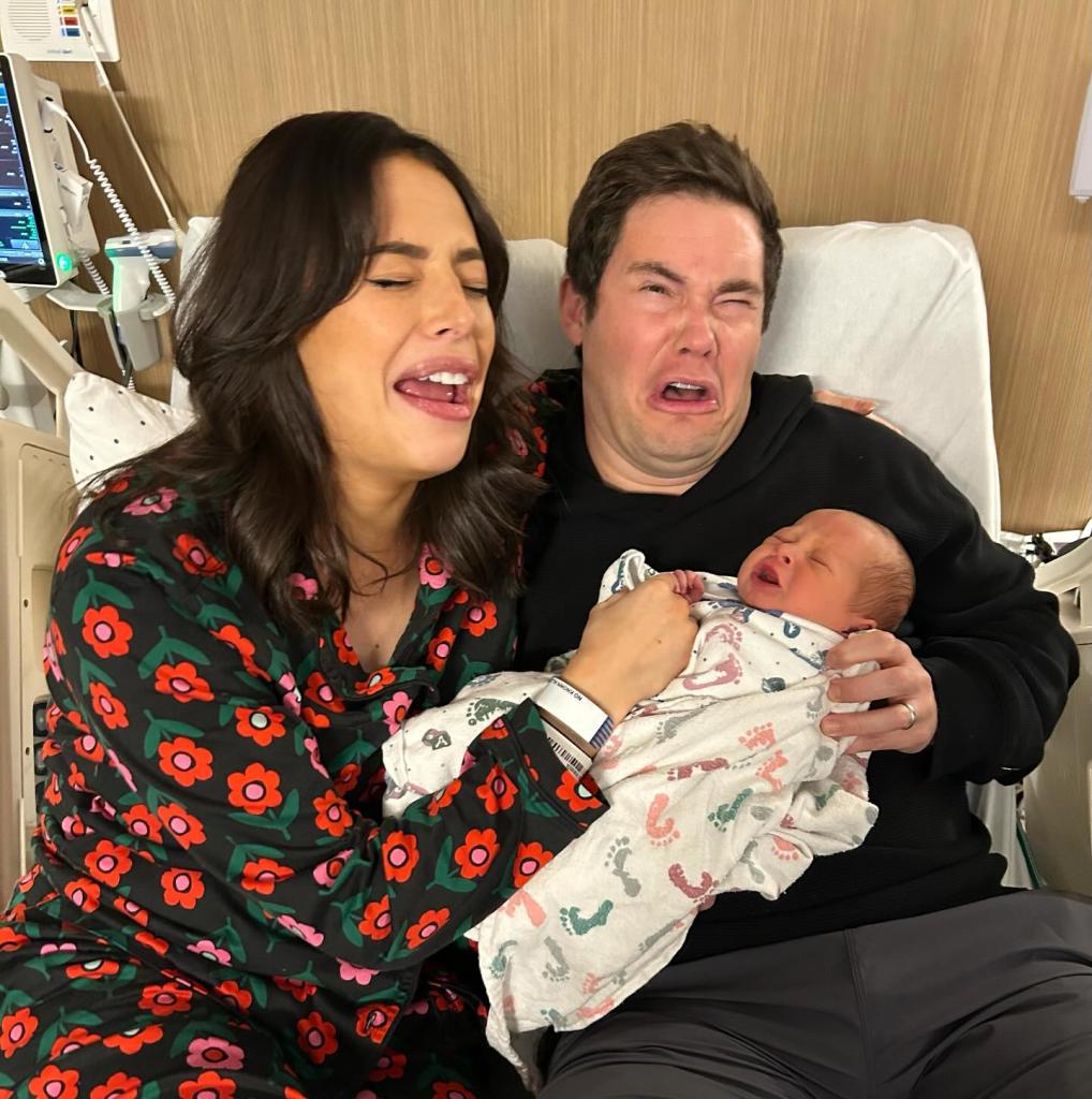 Adam Devine and Chloe Bridges with their newborn Beau